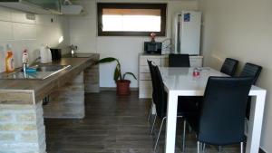 A kitchen or kitchenette at Duna Dráva Vendégház