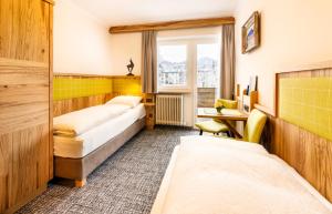 Postelja oz. postelje v sobi nastanitve Hotel Garni Entstrasser