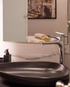 A bathroom at Acropolis Luxury Living