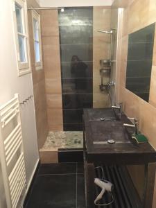 a bathroom with a sink and a shower at Villa Olivea in Rayol-Canadel-sur-Mer