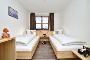 Säng eller sängar i ett rum på Ferienhof Sonne