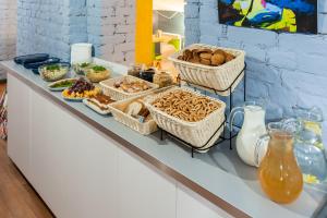 a buffet with baskets of food on a counter at Petrovskiy Art Loft in Saint Petersburg