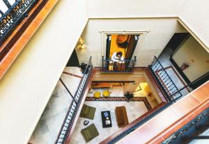 an overhead view of a woman sitting in a window at Joya del Casco Boutique Hotel by Shiadu in Seville