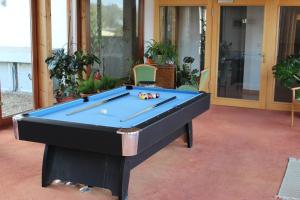 a pool table in the middle of a patio at Hotel am Waldeck mit Restaurant in Eppingen