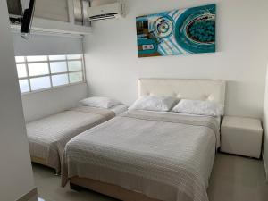 Postel nebo postele na pokoji v ubytování Portofino Cartagena Bocagrande By ICDI + 169 fotografií