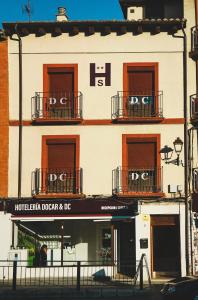 a building with two balconies on a city street at DC Mesones 21 in Lerma