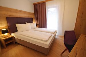 Postel nebo postele na pokoji v ubytování Appartements Parkgasse by Schladming-Appartements