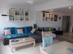 Posezení v ubytování Duplex luxe au NBBC , les pieds dans le sable