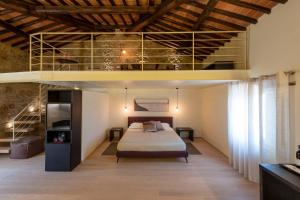 A bed or beds in a room at Mastrojanni Relais