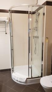 a shower with a glass door in a bathroom at Apartament Magdalena in Świnoujście +24 photos