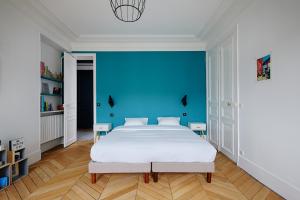 Veeve - Emerald Exuberance tesisinde bir odada yatak veya yataklar
