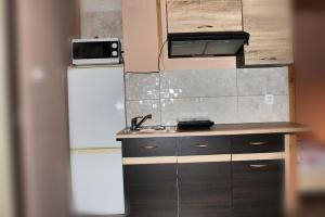 Kuchyňa alebo kuchynka v ubytovaní Pati Apartament Słonko + 10 fotografií