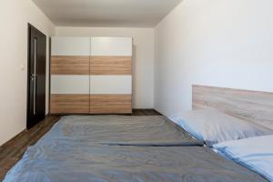 Posteľ alebo postele v izbe v ubytovaní Mami Style Apartments