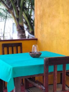 a blue table with a bowl on top of it at Sunset Beach Cabana in Ambalangoda