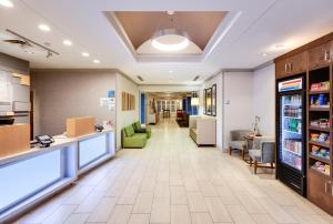 a lobby of a hospital with couches and chairs at Holiday Inn Express Hotel & Suites Dublin by IHG in Dublin +26 photos