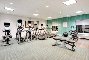 a gym with several treadmills and exercise machines at Holiday Inn Express Hotel & Suites Dublin by IHG in Dublin