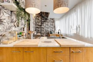 a kitchen with a sink and a counter top at Piazza Di Spagna Fantastic Apartment in Rome