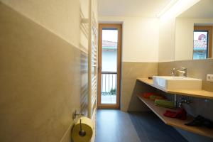 a bathroom with a sink and a toilet at Schlossbichl in Nauders +19 photos