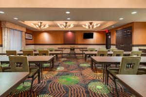 a conference room with tables and chairs and a podium at Holiday Inn Express Hotel & Suites Hobbs by IHG in Hobbs +24 photos