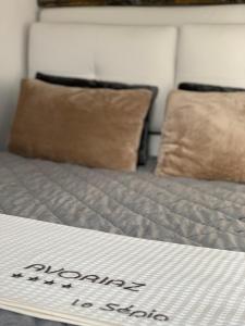 Łóżko lub łóżka w pokoju w obiekcie SUPERBE T2 CLASSÉ, 34 M2, 3ÈME ÉTAGE, RÉSIDENCE « SÉPIA » AVORIAZ
