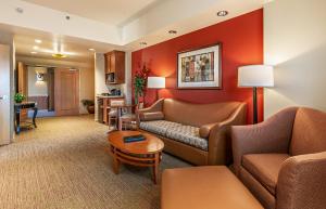 a living room with a couch and a table at Sky Ute Casino Resort in Ignacio
