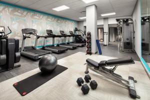 a gym with several treadmills and cardio machines at Crowne Plaza Dallas Market Ctr - Love Field, an IHG Hotel in Dallas