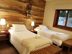 Postel nebo postele na pokoji v ubytování Hotel 381 Panguipulli