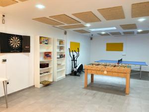 TV a/nebo společenská místnost v ubytování Hispalis Gran Plaza