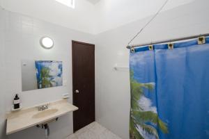 Ванна кімната в Casa Tropical