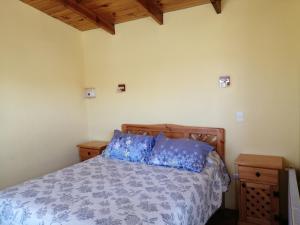 Ένα ή περισσότερα κρεβάτια σε δωμάτιο στο Cabañas Cadizmar