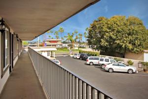 a balcony with cars parked in a parking lot at Hotel 414 Anaheim in Anaheim
