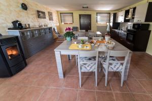 a kitchen with a table and a stove at El Canfin in Montebello Vicentino