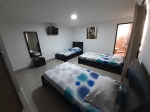 Ένα ή περισσότερα κρεβάτια σε δωμάτιο στο Hotel Prado 53