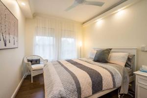 Säng eller sängar i ett rum på Urban Escape - Parramatta