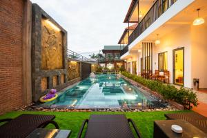 a swimming pool in the middle of a building at Aurora House in Phu Quoc