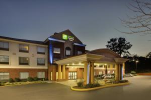 a hotel with a parking lot in front of it at Holiday Inn Express & Suites Laurel, an IHG Hotel in Laurel