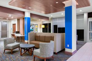 a lobby with a couch and chairs and a table at Holiday Inn Express & Suites - Prosser - Yakima Valley Wine by IHG in Prosser