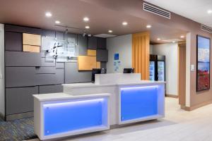 a lobby with a reception desk with blue lighting at Holiday Inn Express & Suites - Prosser - Yakima Valley Wine by IHG in Prosser +37 photos