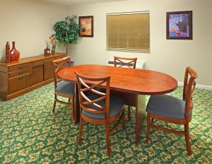 a dining room table and chairs in a room at Candlewood Suites West Little Rock, an IHG Hotel in Little Rock