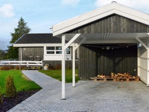 a large barn with chickens sitting inside of it at 6 person holiday home in Svendborg in Svendborg