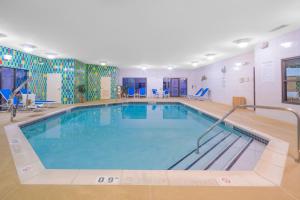 a large swimming pool in a hotel room at Holiday Inn Express Hotel & Suites Easton by IHG in Easton