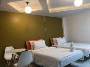 Ένα ή περισσότερα κρεβάτια σε δωμάτιο στο The Northeast Hotel