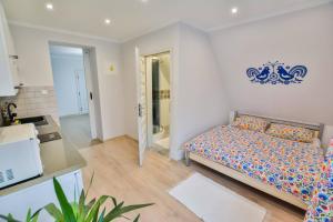 Posteľ alebo postele v izbe v ubytovaní Apartamenty na Galicówce