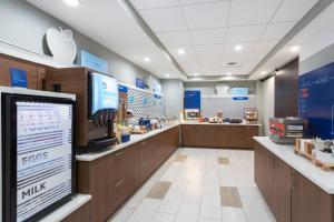 a fast food restaurant with a cash register in a store at Holiday Inn Express & Suites. by IHG in Fleming Island