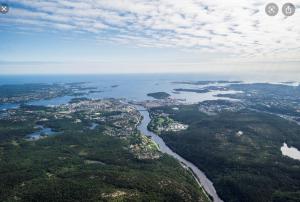 an aerial view of a city and a river at Bullseye Kristiansand in Kristiansand