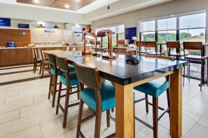 a large dining room with a large table and chairs at Holiday Inn Express Dublin, an IHG Hotel in Dublin