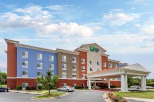 a rendering of a hotel with a parking lot at Holiday Inn Express Arrowood, an IHG Hotel in Charlotte