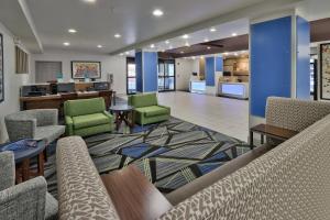 a lobby with couches and chairs and a kitchen at Holiday Inn Express Santa Rosa by IHG in Santa Rosa