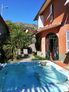 a swimming pool in front of a house at Casa vancanza Sciamandola in Levanto