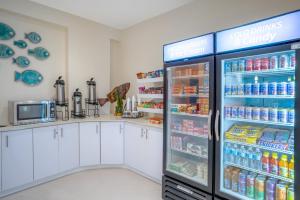 a refrigerator filled with lots of food and drinks at Holiday Inn Express & Suites Nassau, an IHG Hotel in Nassau